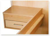 drawer as night table besides a bed-framework